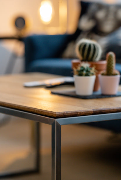 Custom-made coffee table made of polished chrome steel and an oak top